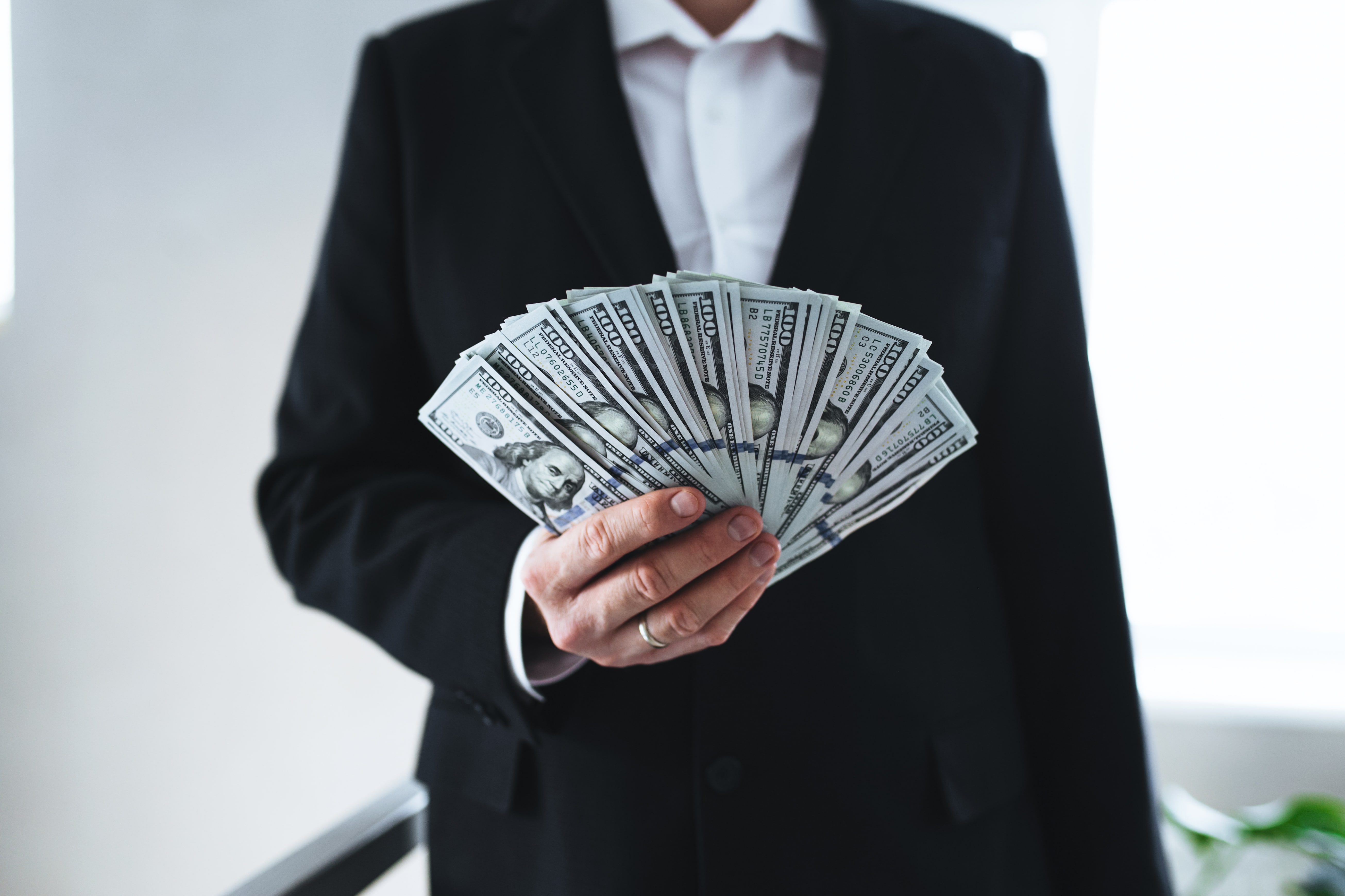one-hundred-dollar-bills-money-fun-in-hand-of-man-2025-03-07-13-00-36-utc-min one-hundred-dollar-bills-money-fun-in-hand-of-man-2025-03-07-13-00-36-utc-min