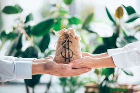 cropped-shot-of-people-holding-sackcloth-bag-with-2024-11-17-07-05-34-utc