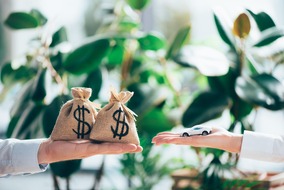 cropped-shot-of-people-exchanging-sackcloth-bags-w-2024-11-17-22-44-42-utc-min