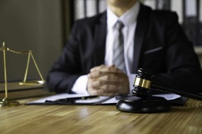 attorney-reading-law-code-studying-constitution-to-protect-human-rights-closeup-male-lawyer-or-jud